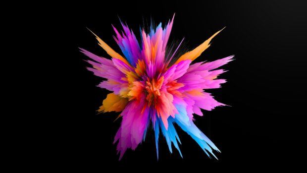 Vibrant powder explosion with pink orange and blue colors on a black background