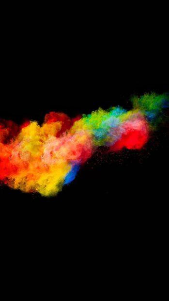 Colorful powder explosion creating vibrant abstract shapes on a black background