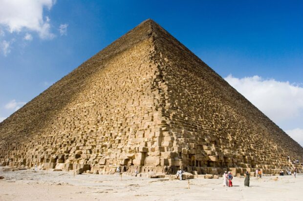 The Great Pyramid at Giza with detailed stone blocks under a clear blue sky