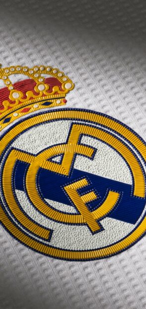 Close up view of Real Madrid Cf logo on textured fabric surface