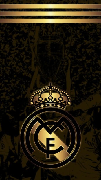 Real Madrid Cf logo in gold shining on a dark abstract background with celebration scene