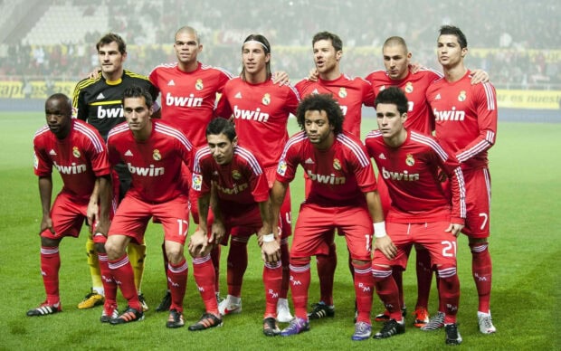 Real Madrid Cf team posing together on football field before the match