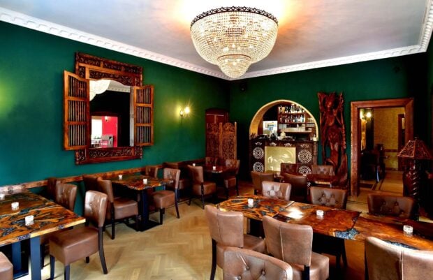 Elegant restaurant interior with luxurious wooden furniture and stylish decoration
