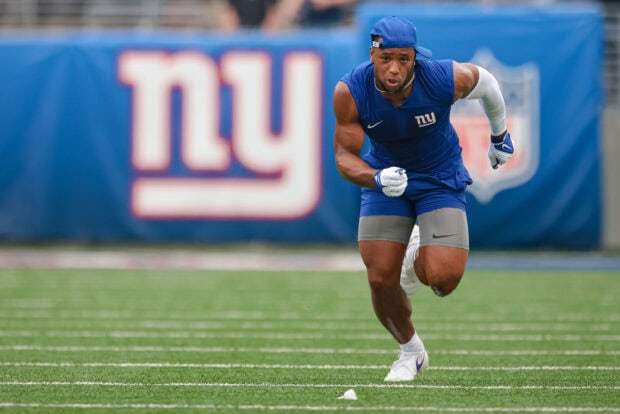 Saquon Barkley running on the football field during training camp session