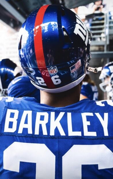 Saquon Barkley player wearing a blue jersey with number 26 on a football helmet
