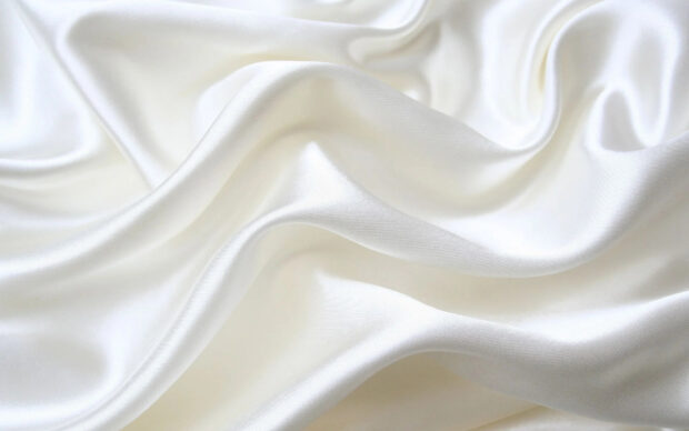 Smooth satin fabric texture with soft folds and elegant shine