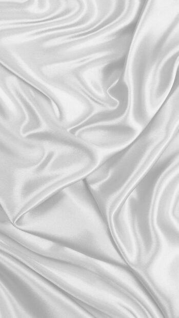 Smooth satin fabric texture with elegant folds and shiny surface