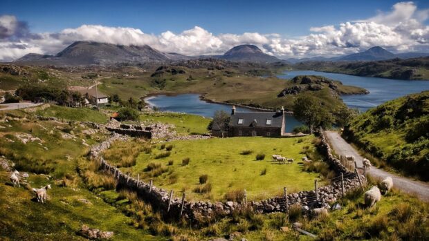 Beautiful Scottish countryside landscape with green fields and mountains in Scotland