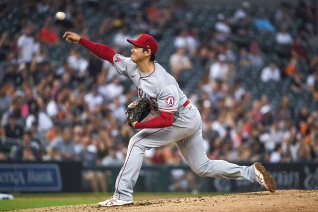 Shohei Ohtani pitching during a baseball game in Angels uniform on the mound