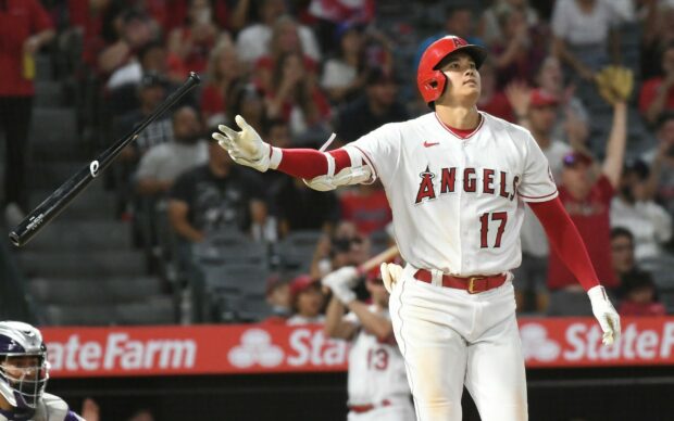 Shohei Ohtani preparing to bat during a baseball game with a focused expression