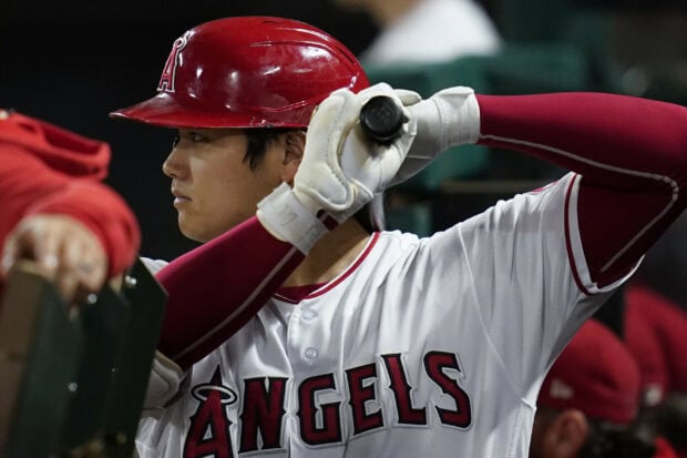 Shohei Ohtani preparing to bat in an Angels uniform during a baseball game