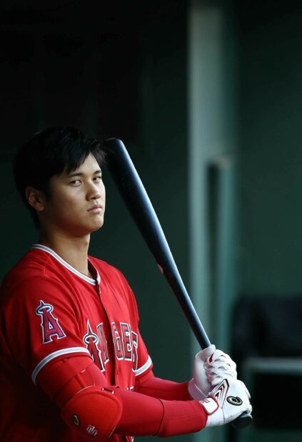 Shohei Ohtani preparing to bat in a Los Angeles Angels uniform with protective gear