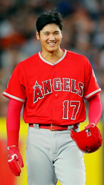 Shohei Ohtani smiling in Angels baseball uniform wearing number 17 on jersey