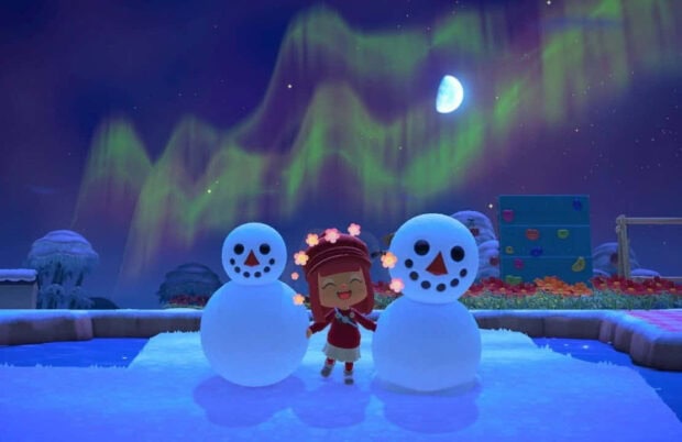 A character standing between two snowmen under northern lights in winter night