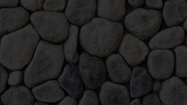 Close up of dark stone texture in irregular shapes and rough surfaces