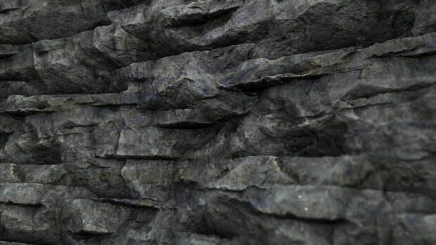 Close up view of rough stone texture with natural rock surface details