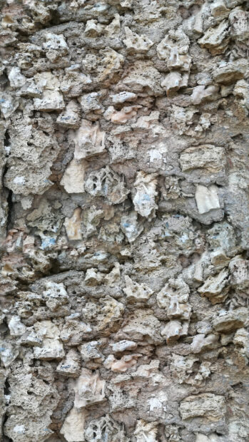 Rough and uneven stone texture showcasing natural stone patterns and formations