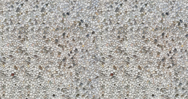 Small smooth stones texture creating a natural stone texture pattern on the ground