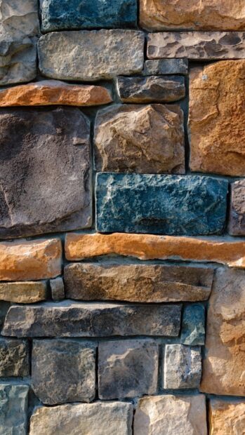 Close up of natural stone texture displaying various colors and rough surface details