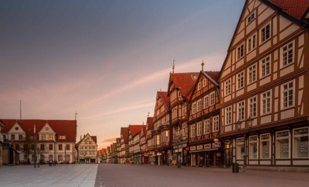 Charming town street with traditional timber houses under a soft evening sky