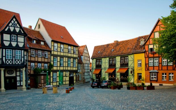 Traditional town buildings with colorful facades and cobblestone street