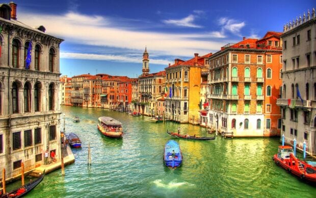 Historic Venice canal with colorful buildings and boats on the water