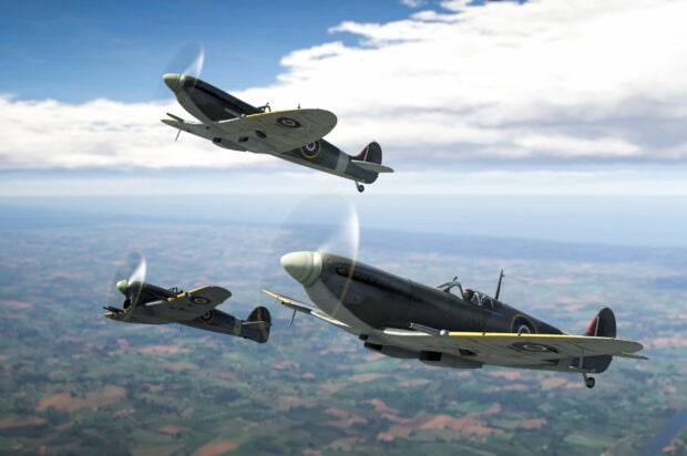 Three World War II fighter planes flying over the countryside in War Thunder