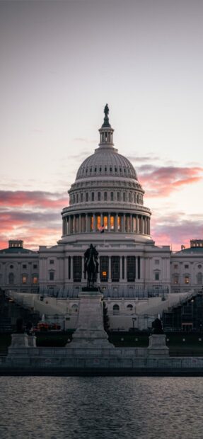 The iconic washington dc dome building captured at sunset with vibrant sky colors