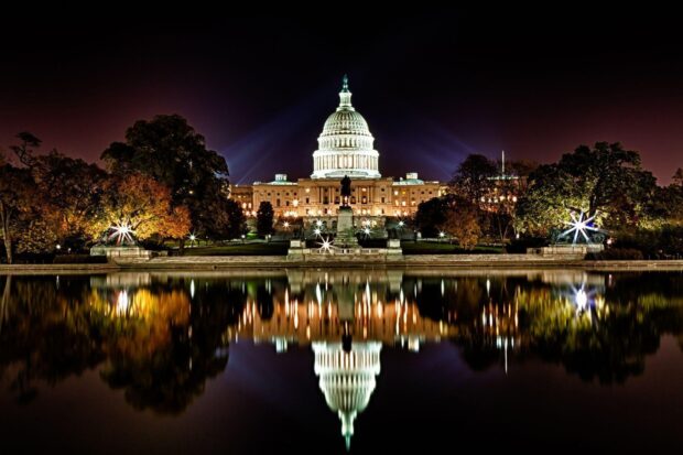 The stunning Washington Dc building illuminated at night with reflections in the water