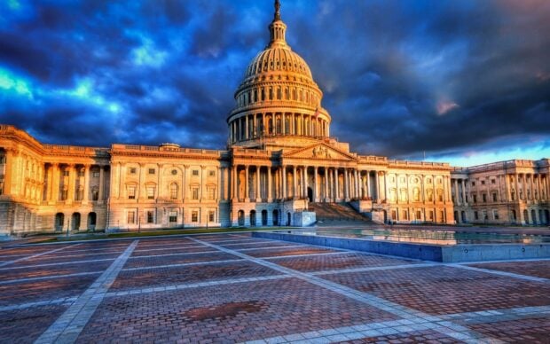 The Capitol building as a famous Washington Dc landmark under a dramatic sky