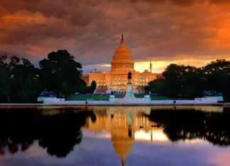 Washington Dc Capitol building with sunset sky reflecting on water in Washington Dc
