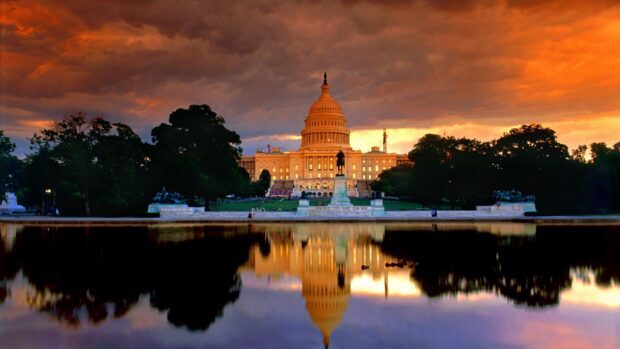 Washington Dc Capitol building with sunset sky reflecting on water in Washington Dc