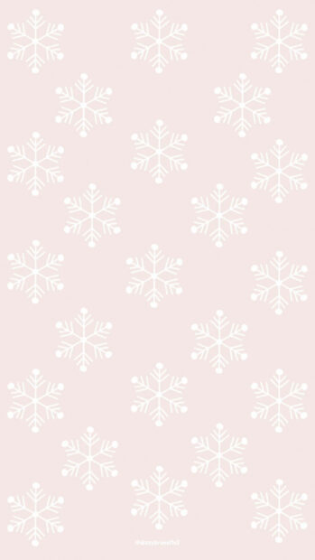 White snowflakes pattern on a soft pink background with a cute winter theme