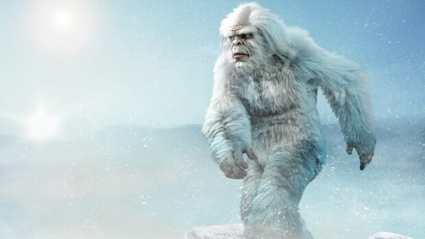 A white bigfoot creature walking through a snowy landscape with icy wind blowing
