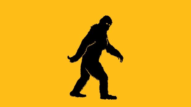 Silhouette of bigfoot walking with glowing eyes on a vibrant yellow background