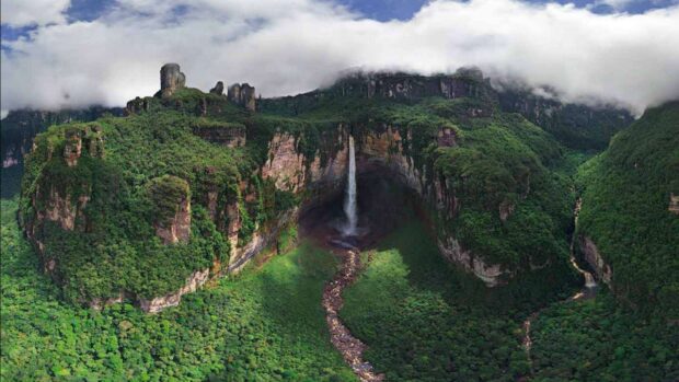 Lush Canaima National Park landscape with a tall waterfall and dense green forest