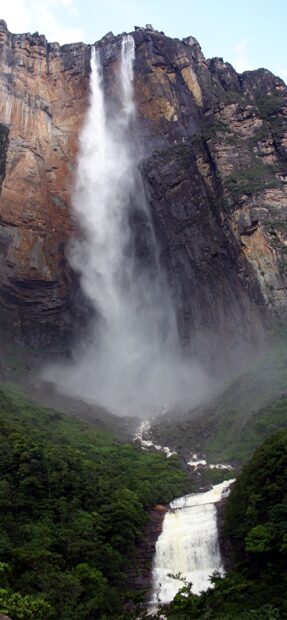 Majestic waterfall in Canaima National Park surrounded by lush green rainforest