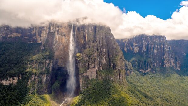 Angel Falls in Canaima National Park surrounded by lush forest and cliffs