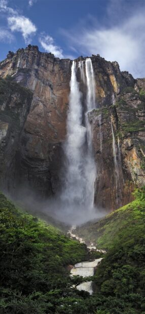 Angel Falls waterfall in Canaima National Park surrounded by lush greenery and rocky cliffs