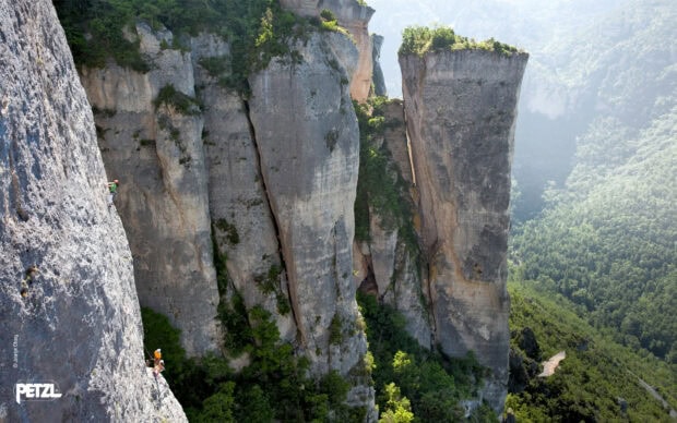 Rock climbing adventure on steep cliffs in a mountainous forest area