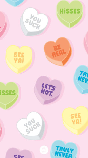 Colorful candy hearts with funny phrases on a pink background valentines