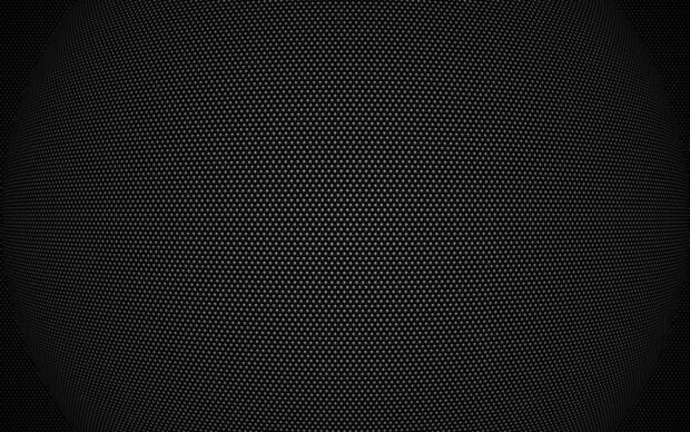 A close up view of black dots pattern creating a textured surface on a spherical shape