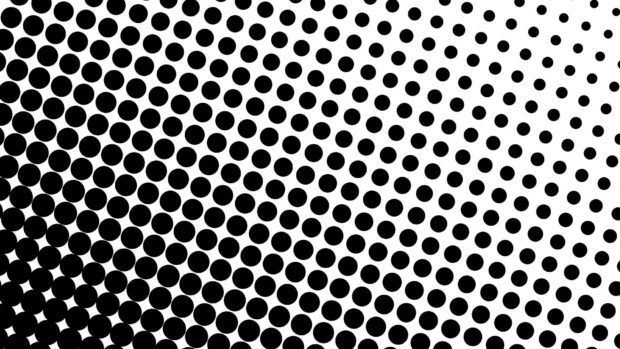 Black dots pattern with varying sizes on a white background creating a dynamic visual effect