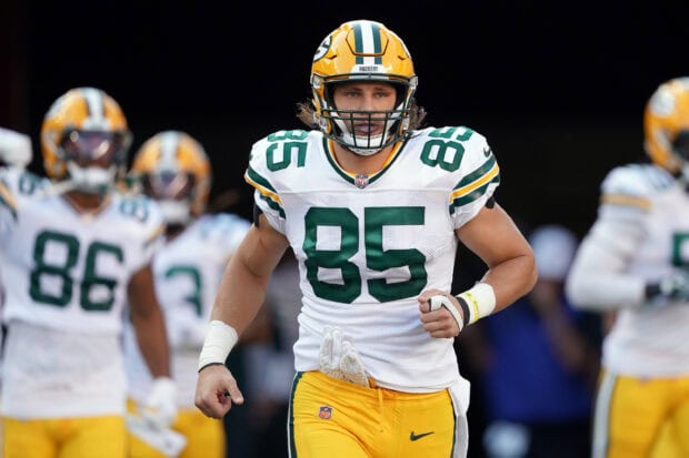 Green Bay Packers player wearing number 85 jersey running on the field