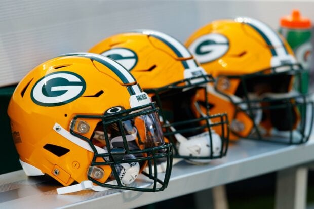 Green Bay Packers helmet with team logo on a bench
