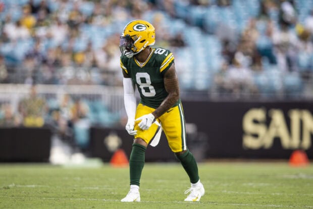 Green Bay Packers player preparing for a play on the football field