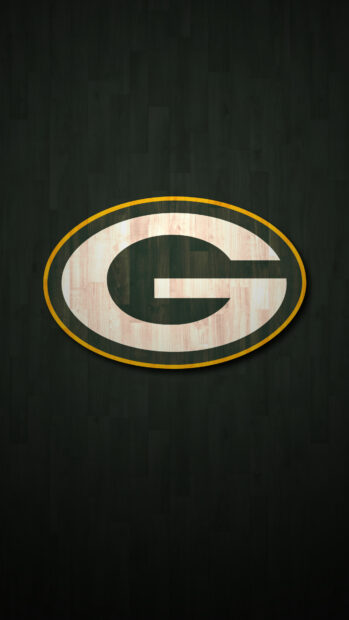 Green Bay Packers logo on a dark wooden textured background
