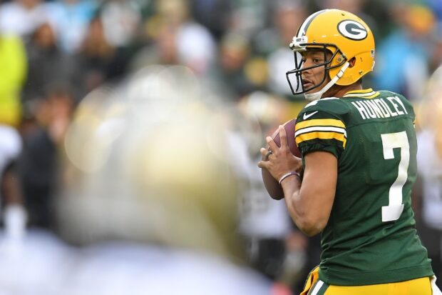 Green Bay Packers player preparing to throw the ball during a game with Packers jersey number 7 visible