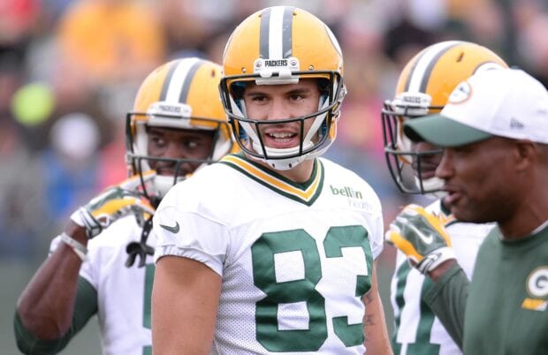 Green Bay Packers player wearing number 83 helmet on the field during a game