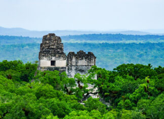 Guatemala Wallpapers 2K Desktop Ancient Mayan ruins surrounded by dense Guatemala forest in the distance
